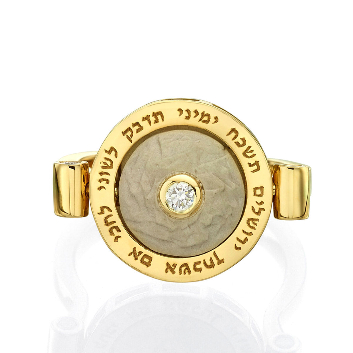 A gold ring set with a Jerusalem stone and a diamond