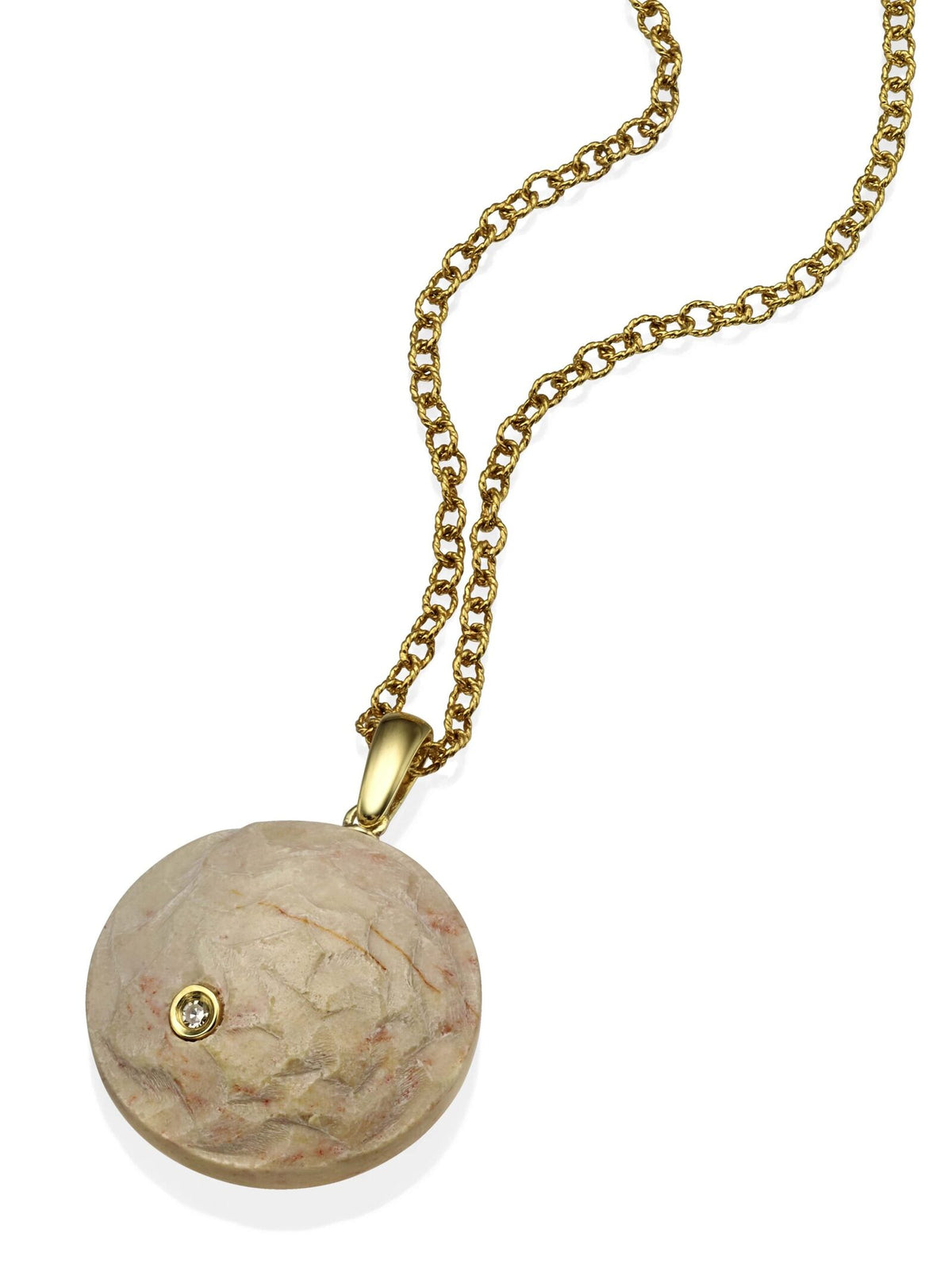 A stone pendant from the Temple Mount in the form of a diamond-encrusted coin